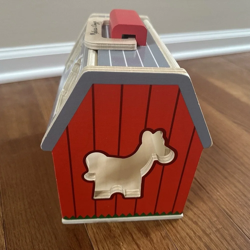 Melissa & Doug‎ Wooden Take-Along Sorting Barn Toy with Flip-Up Roof, 9 Pieces.